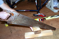cutting wood for the ski bike
